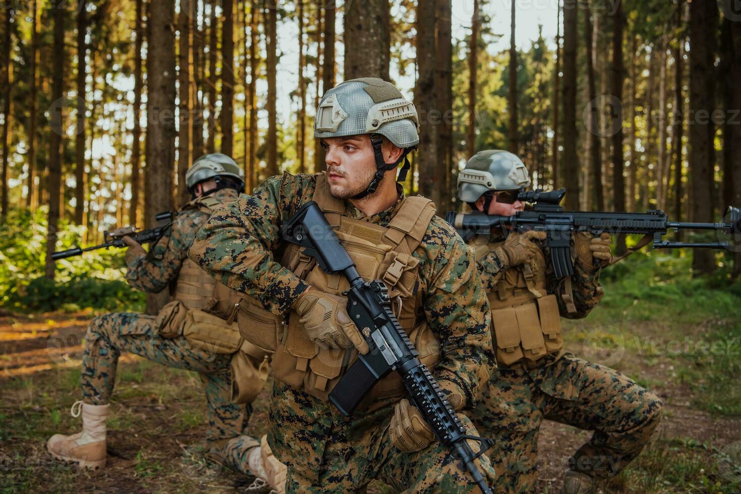 Soldier fighters standing together with guns. Group portrait of US army elite members, private military company servicemen, anti terrorist squad photo