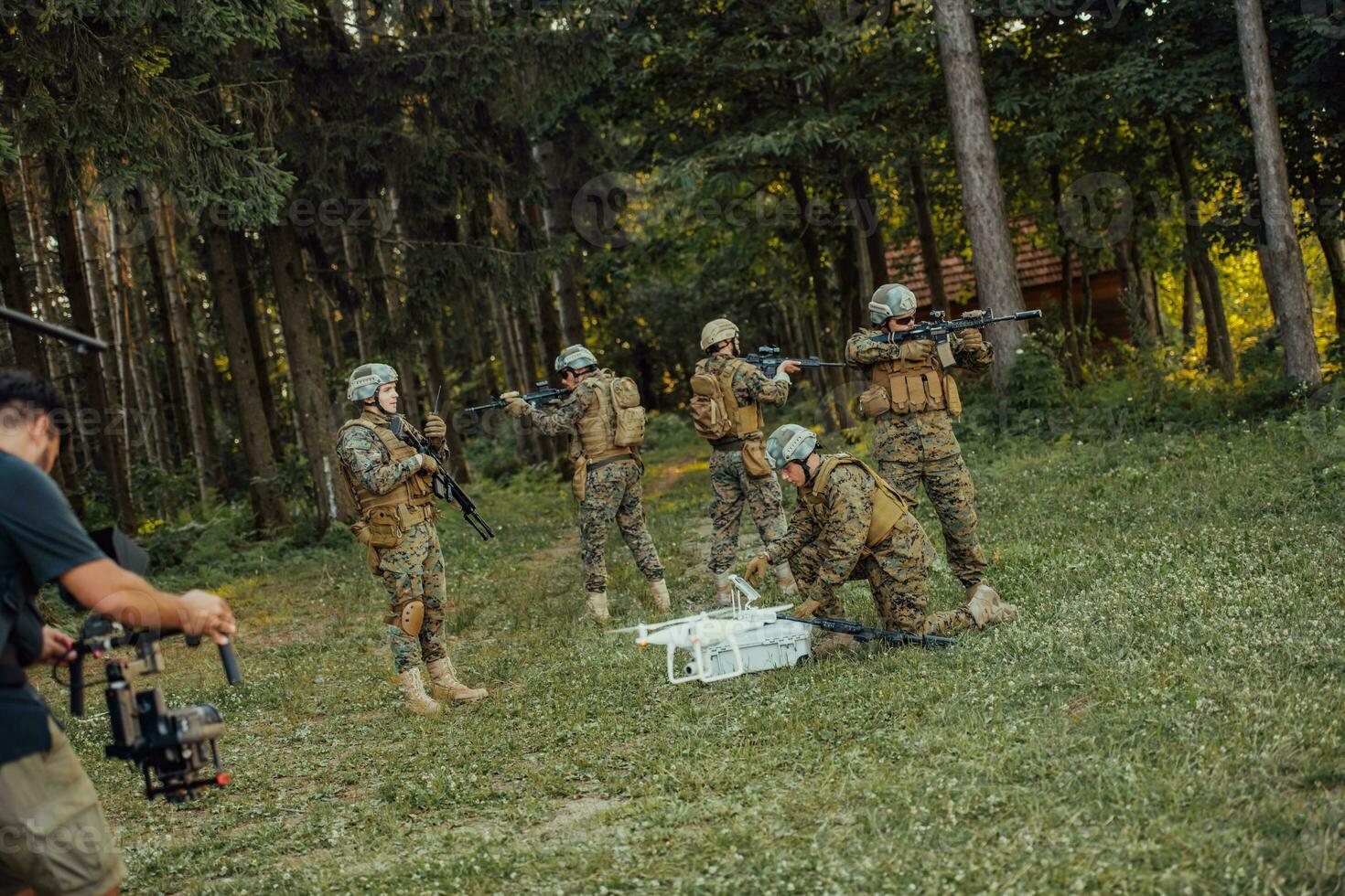 Modern Warfare Soldiers Squad are Using Drone for Scouting and Surveillance During Military Operation in the Forest. photo