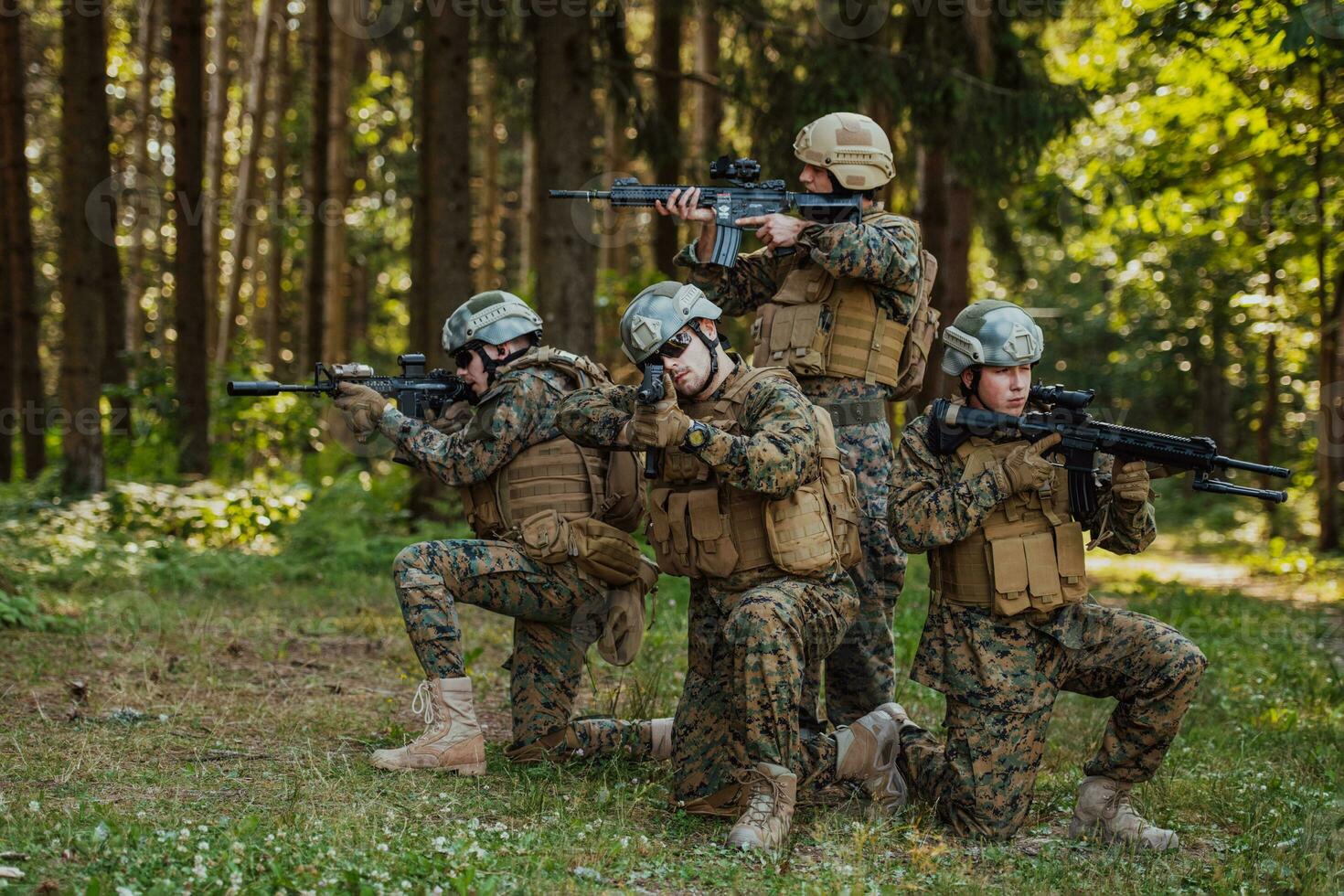 Soldier fighters standing together with guns. Group portrait of US army elite members, private military company servicemen, anti terrorist squad photo
