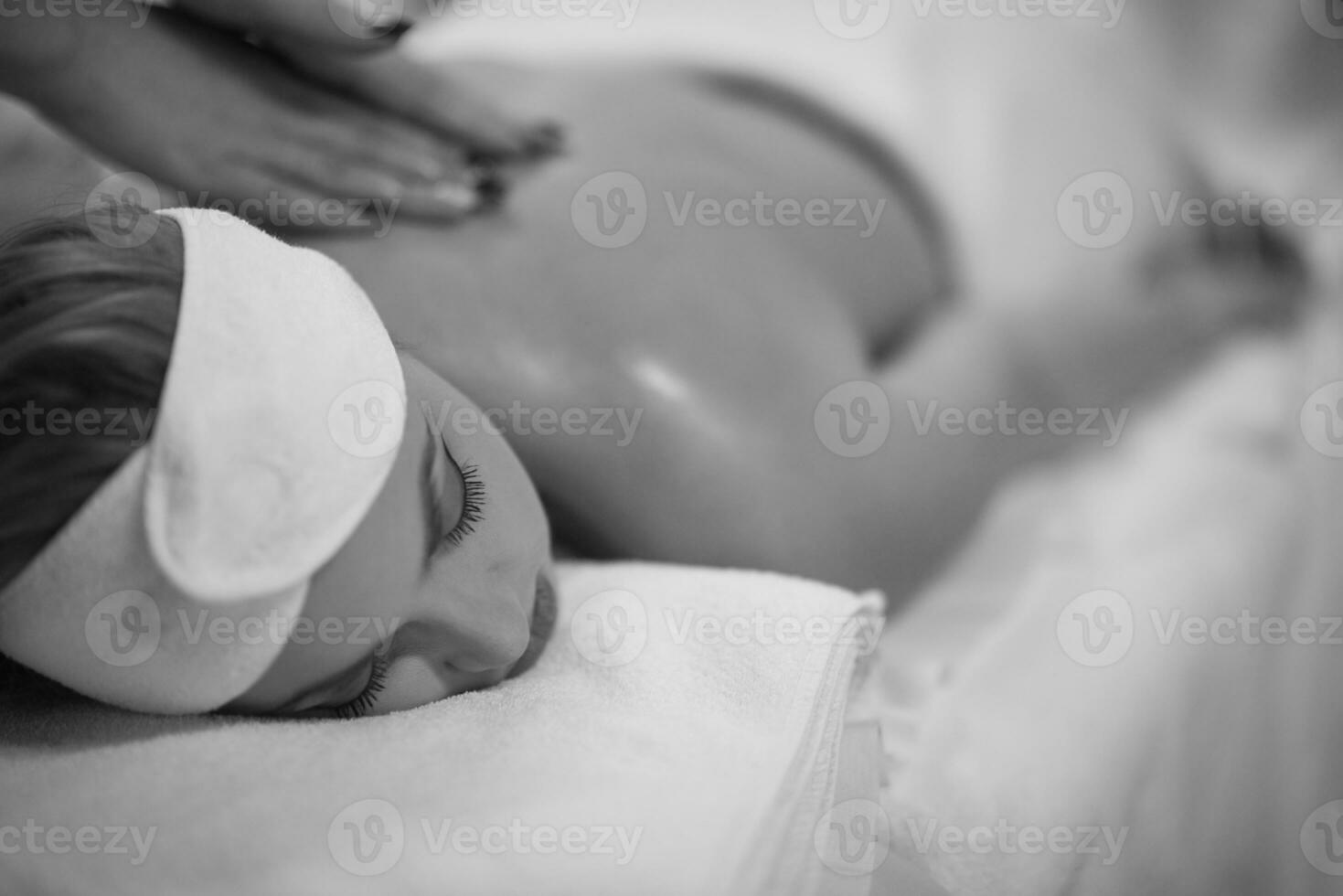 woman receiving a back massage photo