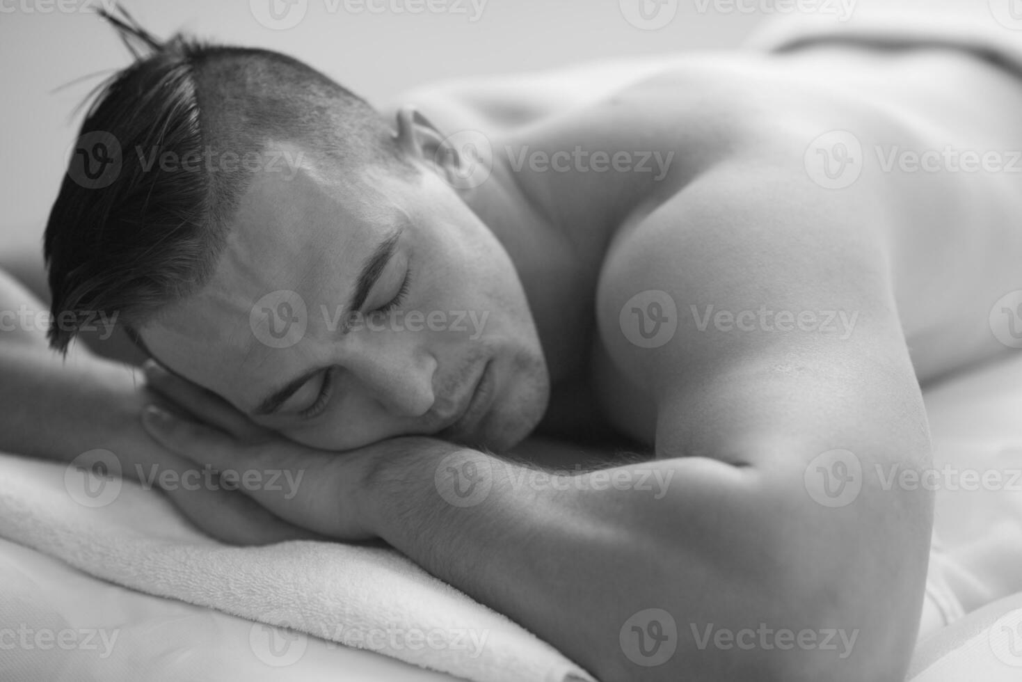 handsome man resting in a spa massage center photo