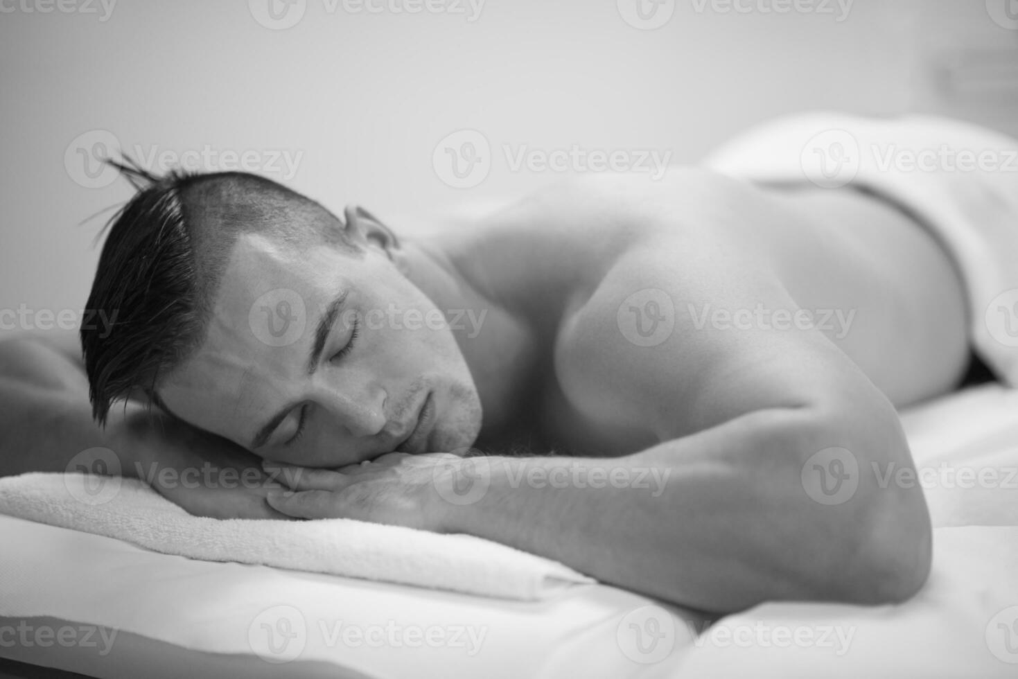 handsome man resting in a spa massage center photo