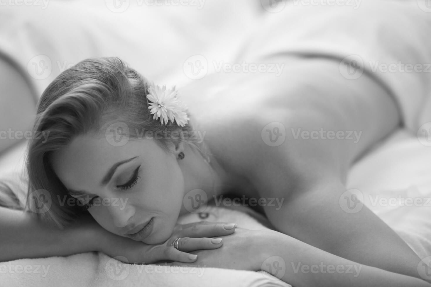 woman laying on massage table photo