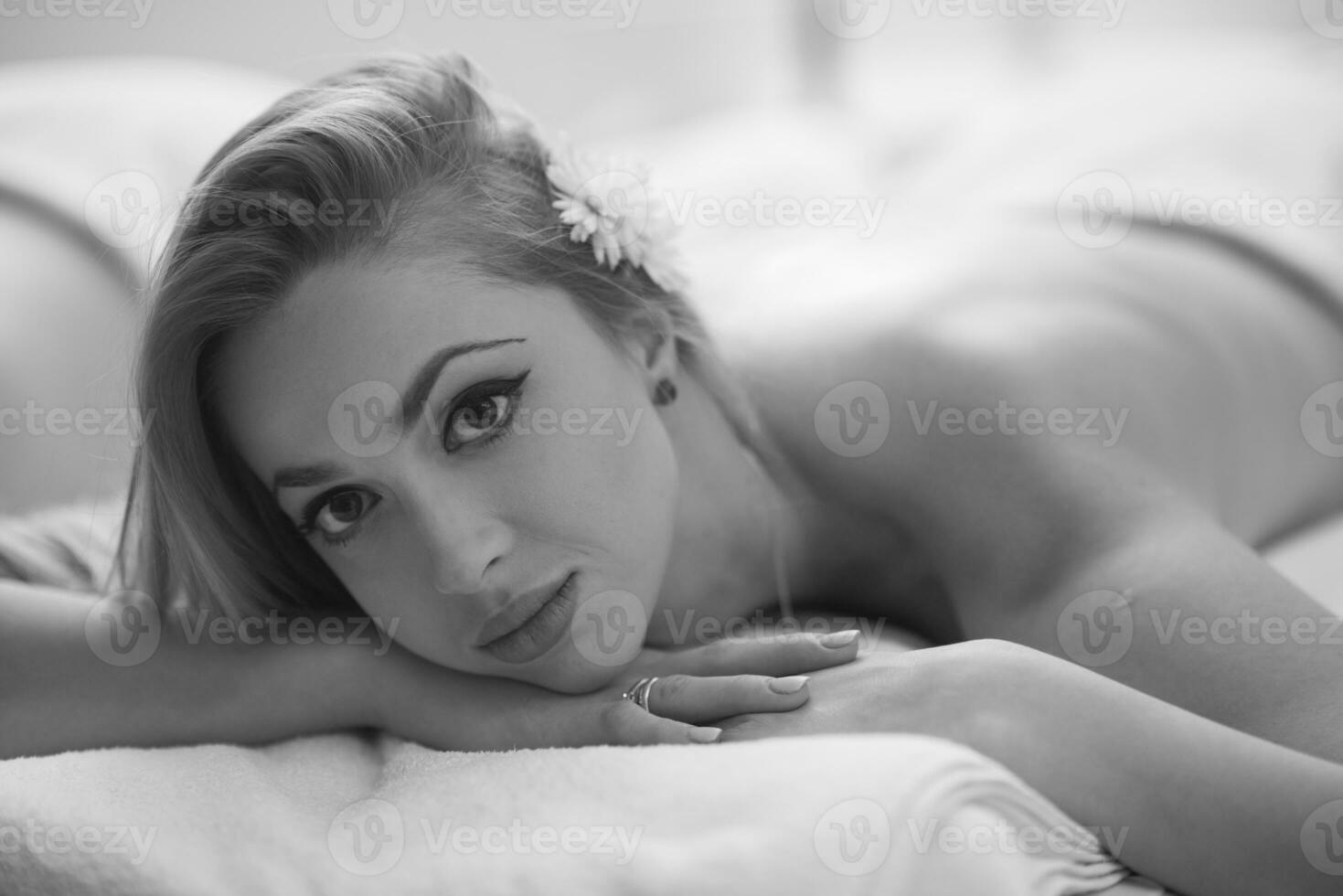 woman laying on massage table photo