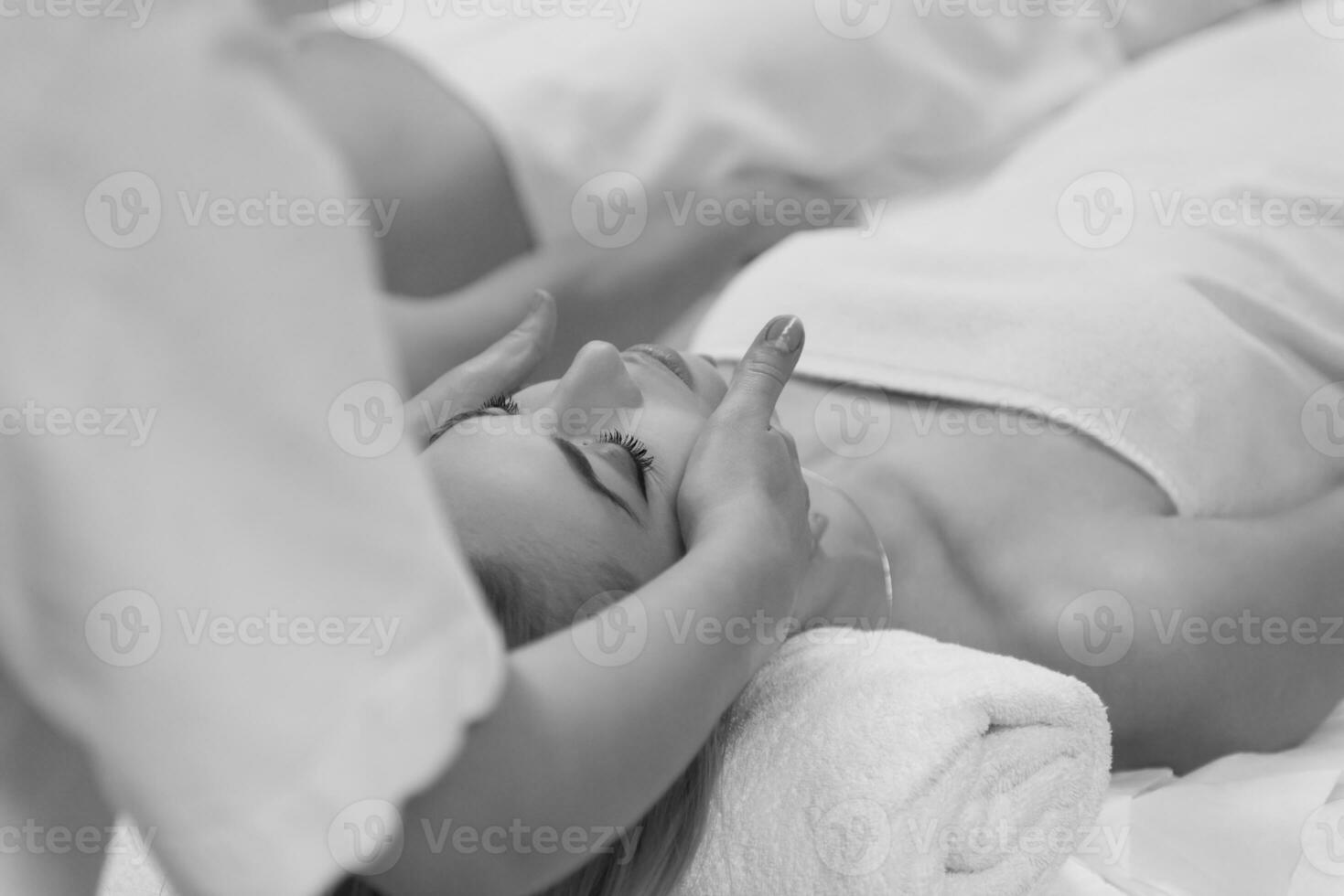 woman receiving a head massage photo