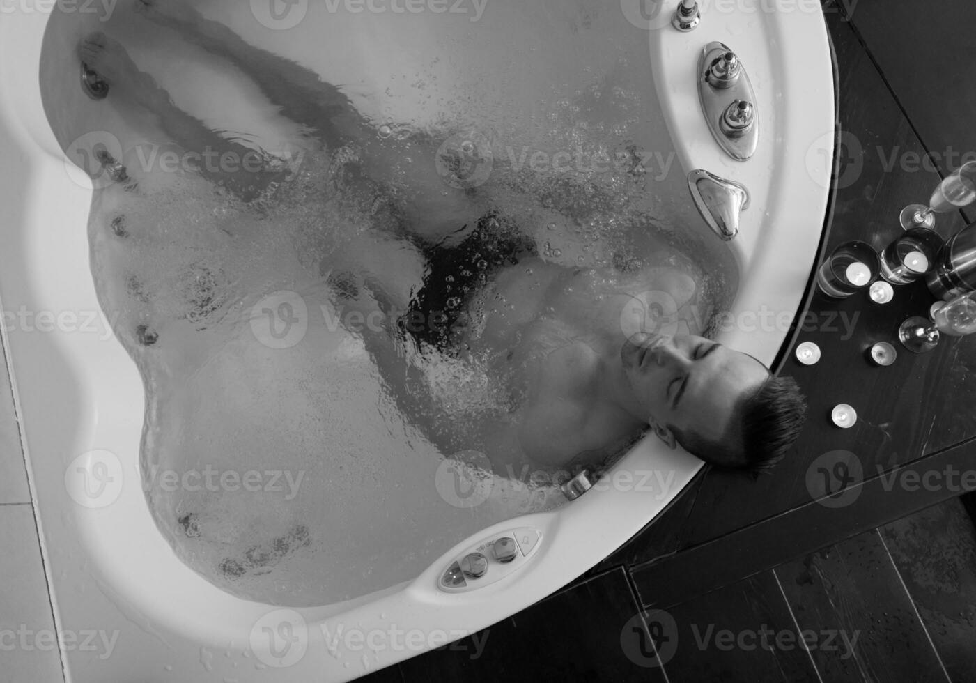 man relaxing in the jacuzzi photo