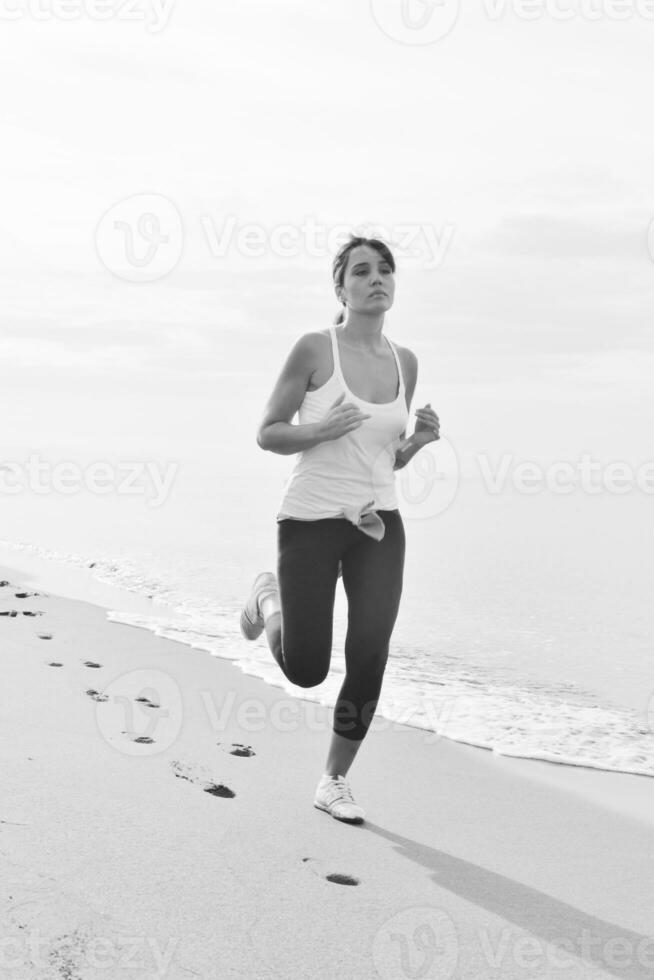 woman running on beach photo