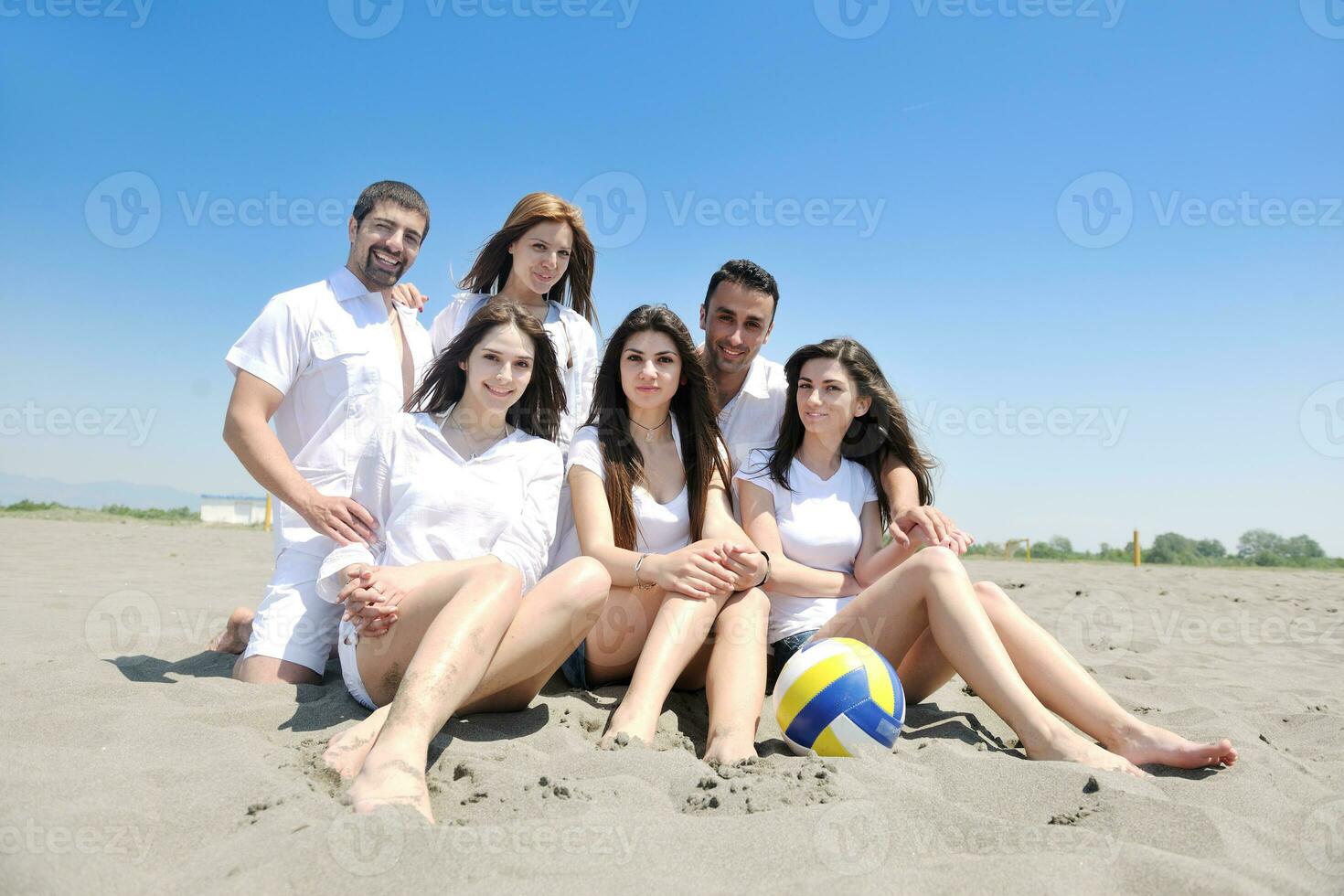 happy young  people group have fun on beach photo