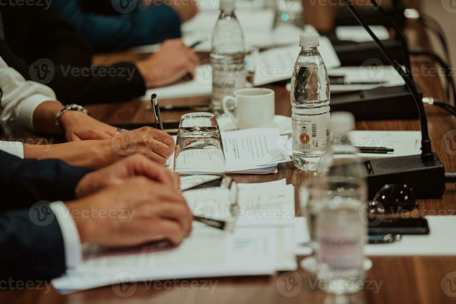 Close-up photo of businessmen who are at a meeting and business meeting in a modern hall