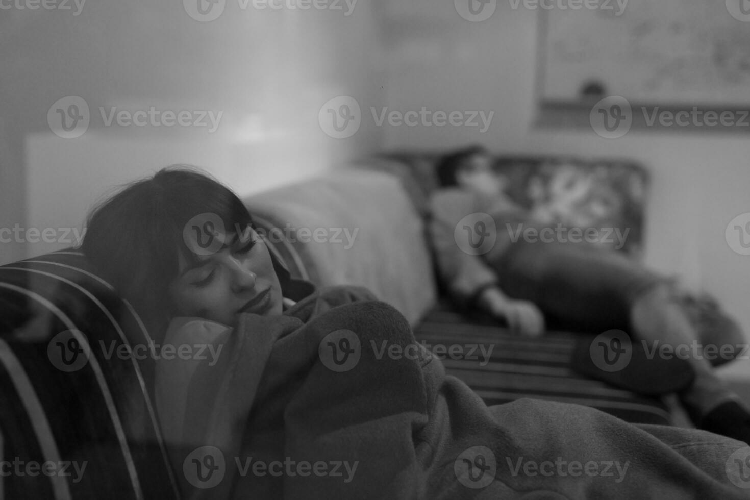 software developers sleeping on sofa in creative startup office photo