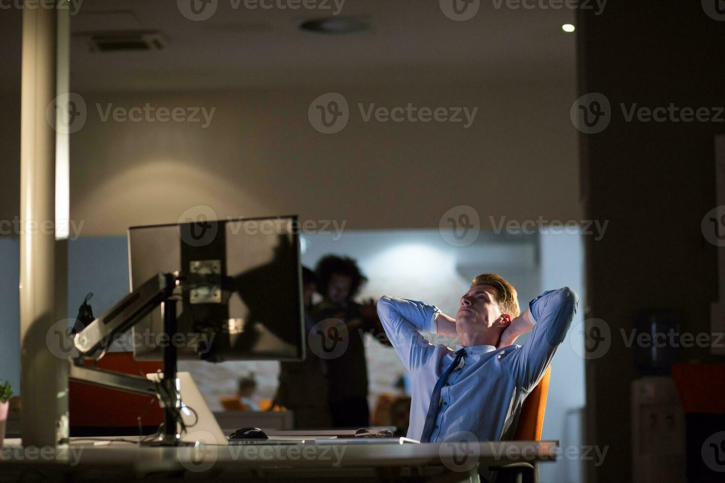 businessman relaxing at the desk photo