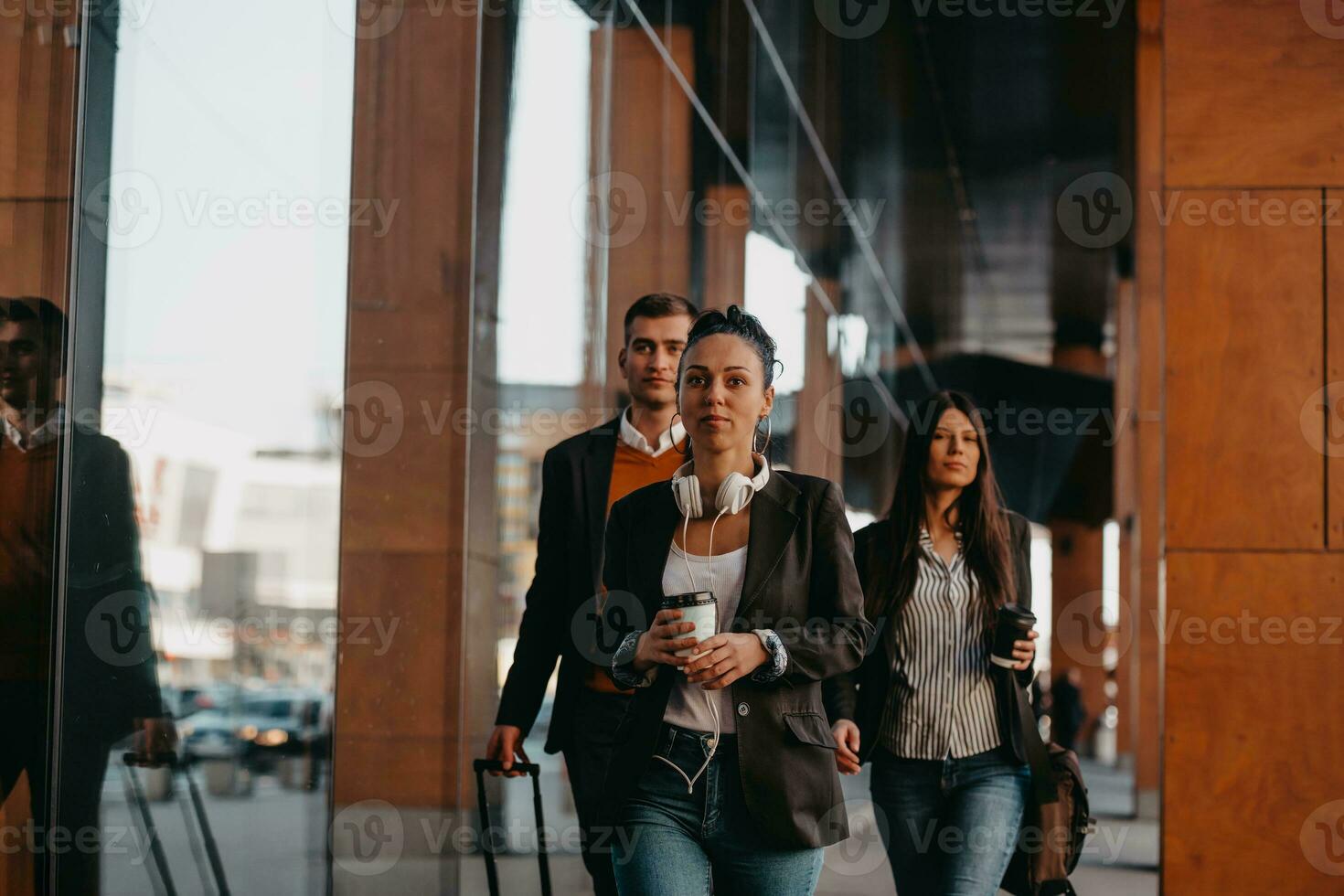 Elegant businesspeople walking in a modern city.. photo