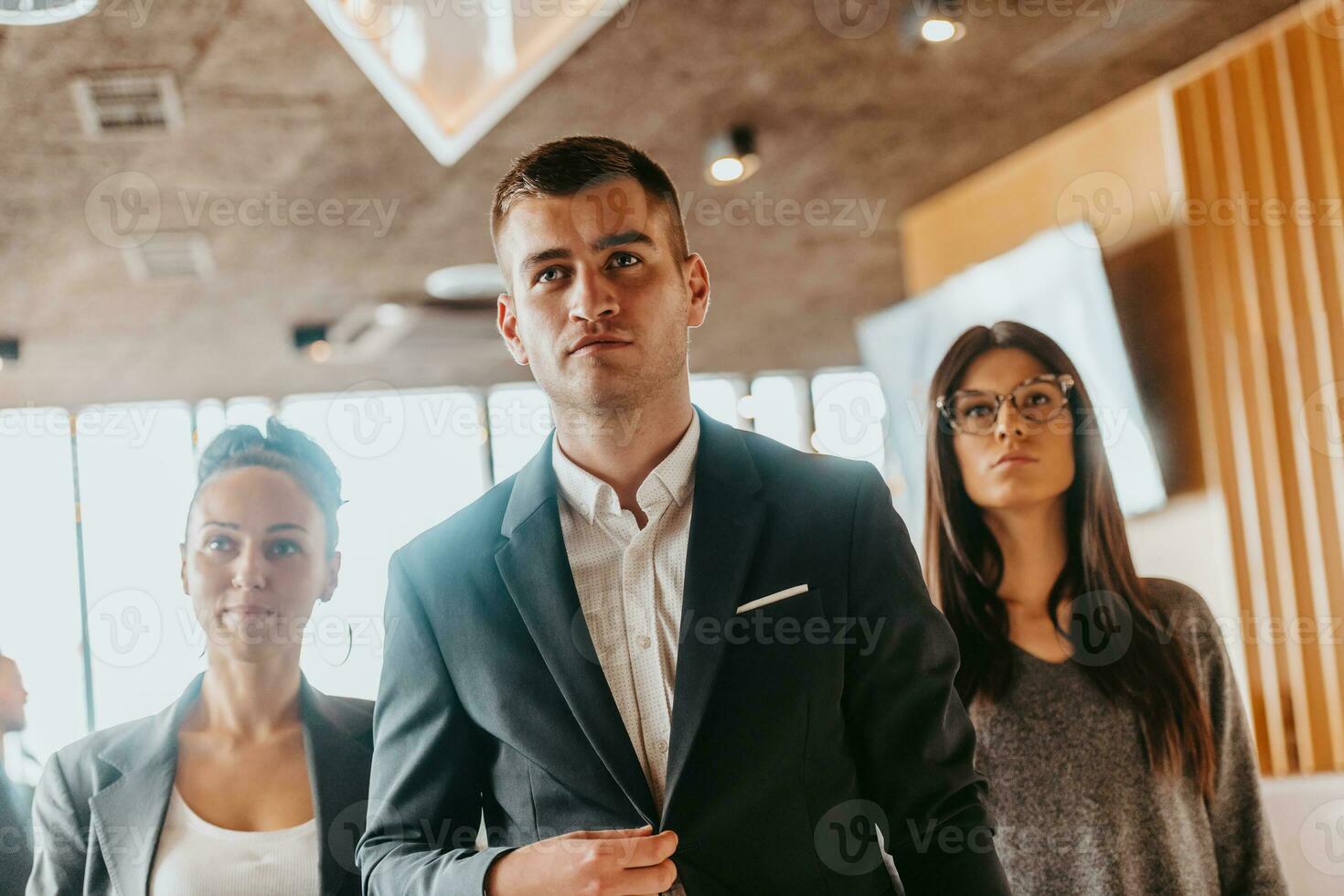 Group of successful business people standing together at office. photo