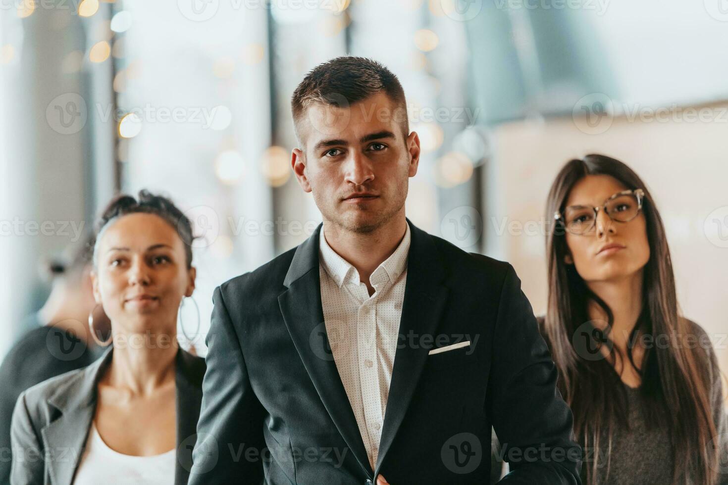 Group of successful business people standing together at office. photo