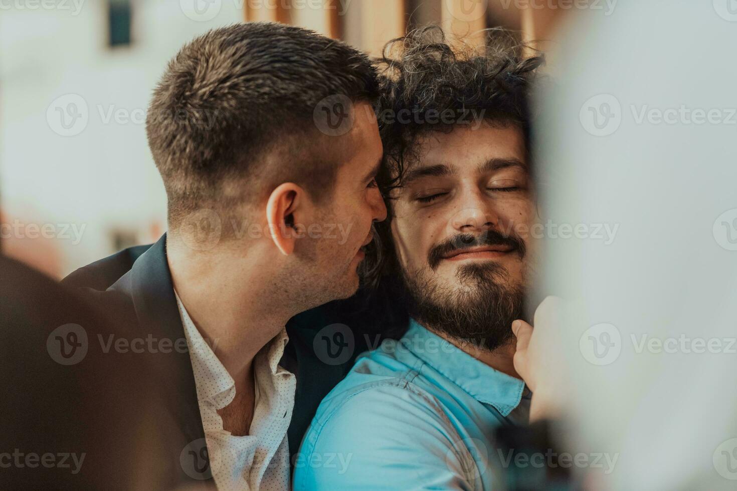 Portrait of multiethnic diverse gay LGBT romantic male couple embracing and showing their love photo