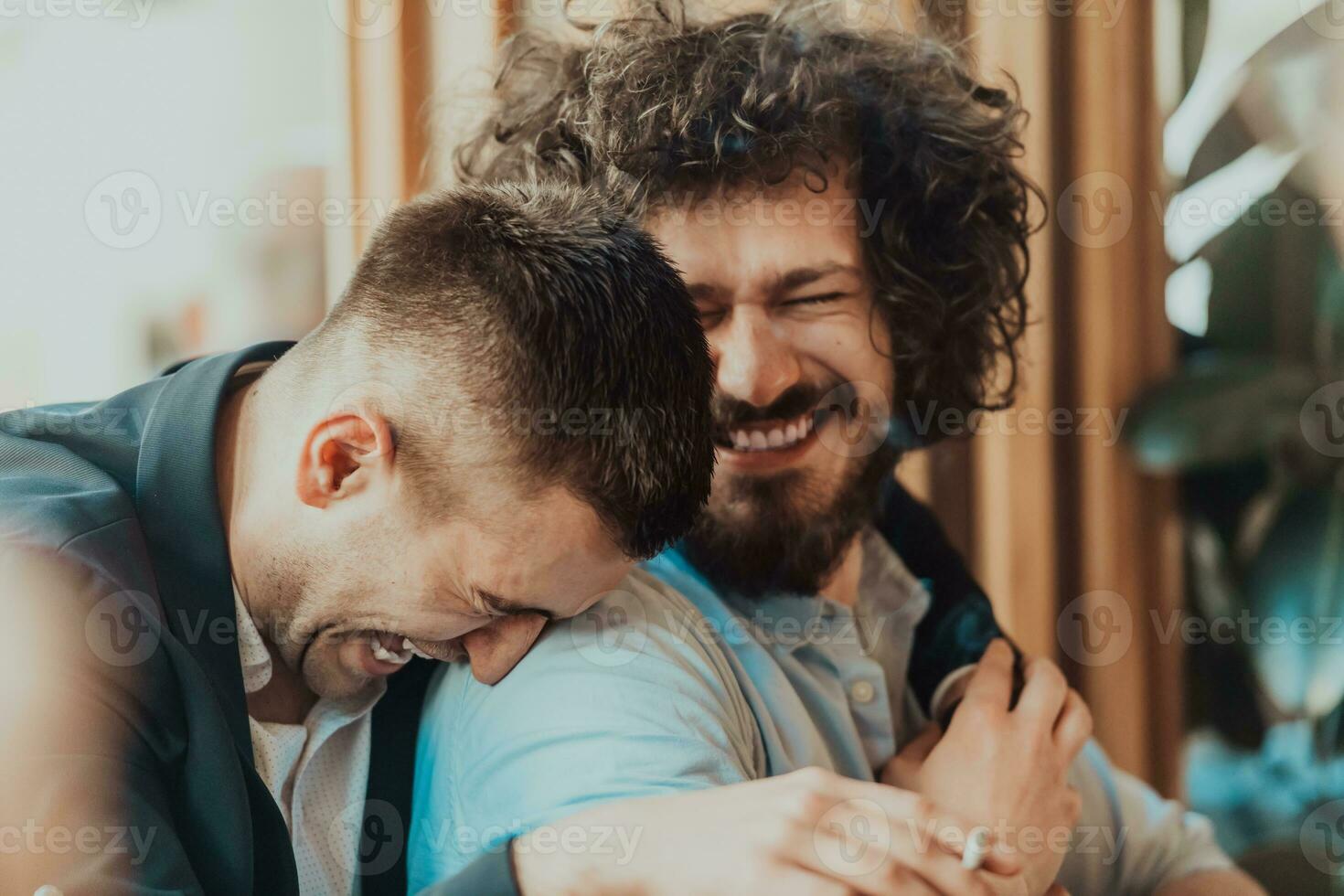 Portrait of multiethnic diverse gay LGBT romantic male couple embracing and showing their love photo