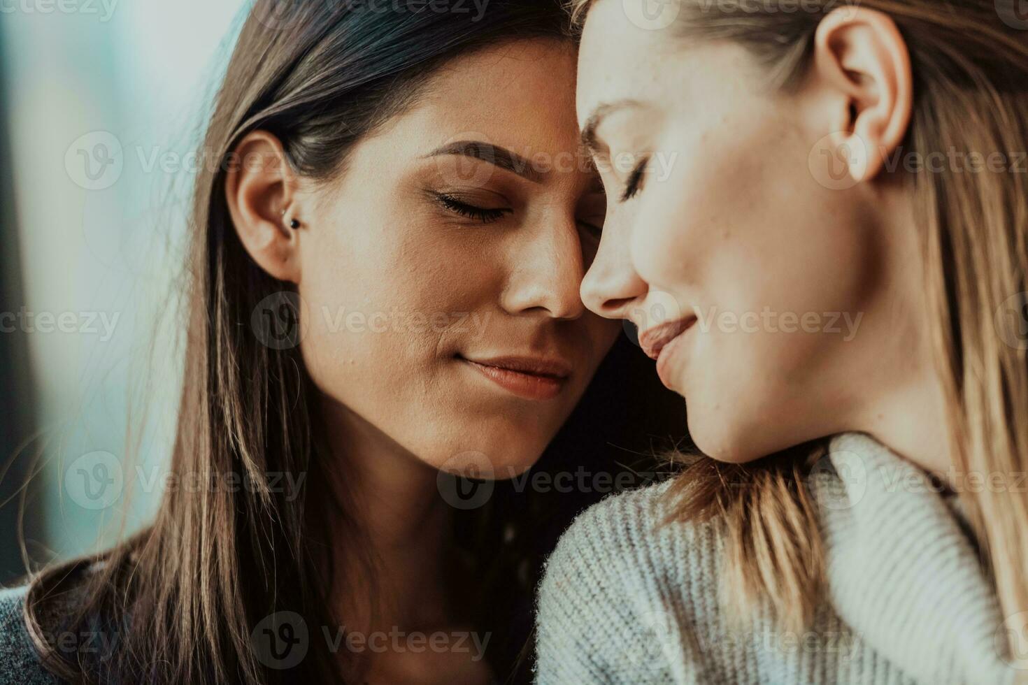 Diverse friends girls lesbian couple hugging. Stylish cool generation z women dating in love enjoy romantic relationships photo