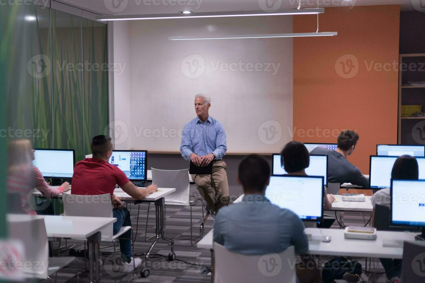 teacher and students in computer lab classroom photo