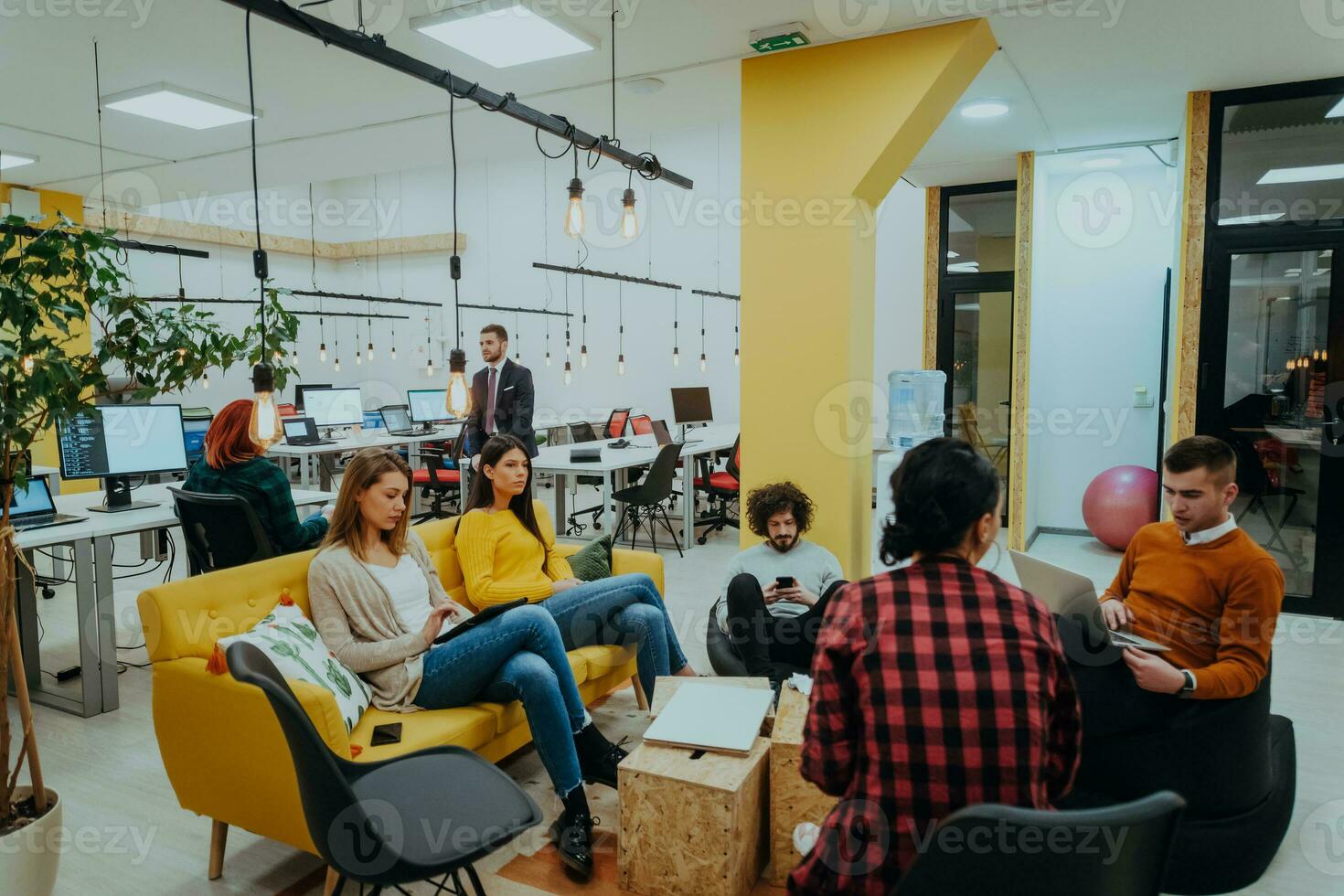 Multiethnic group of employees working in a marketing company. A group of colleagues is working on a project in modern offices photo
