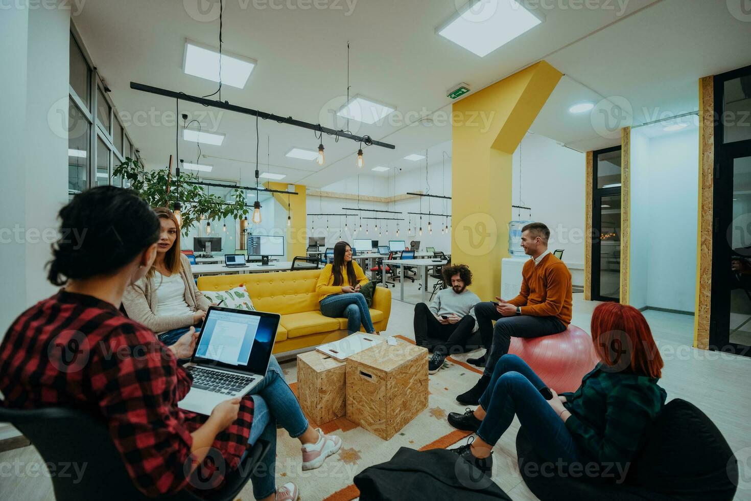 Multiethnic group of employees working in a marketing company. A group of colleagues is working on a project in modern offices photo