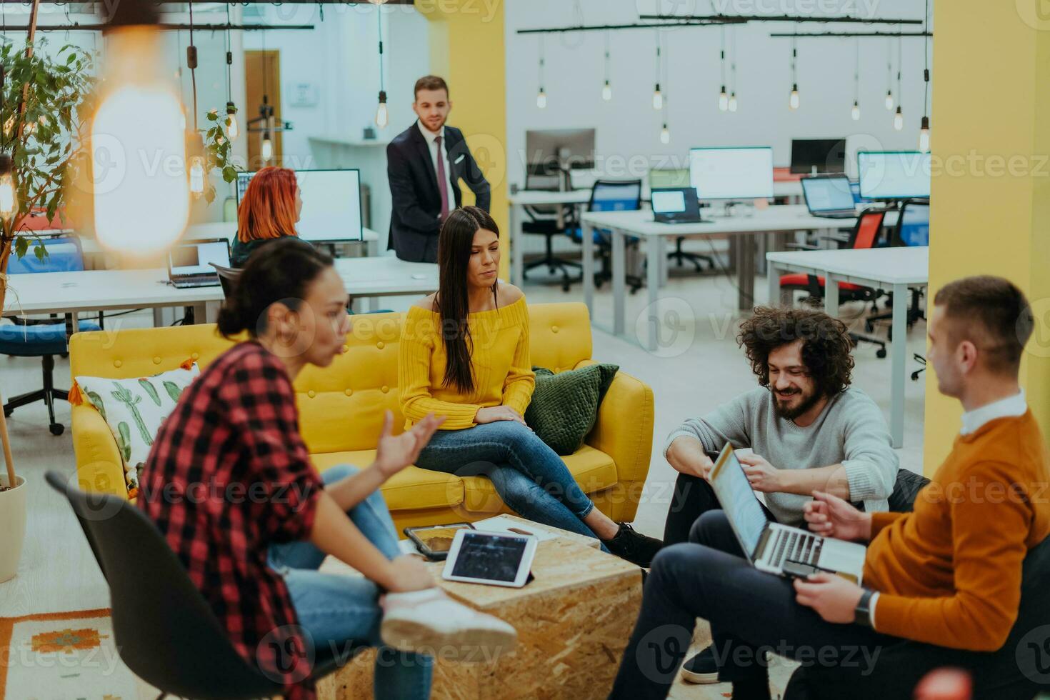 Multiethnic group of employees working in a marketing company. A group of colleagues is working on a project in modern offices photo