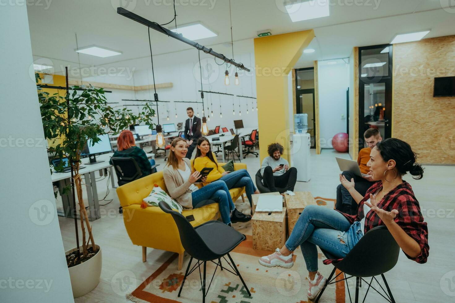 Multiethnic group of employees working in a marketing company. A group of colleagues is working on a project in modern offices photo