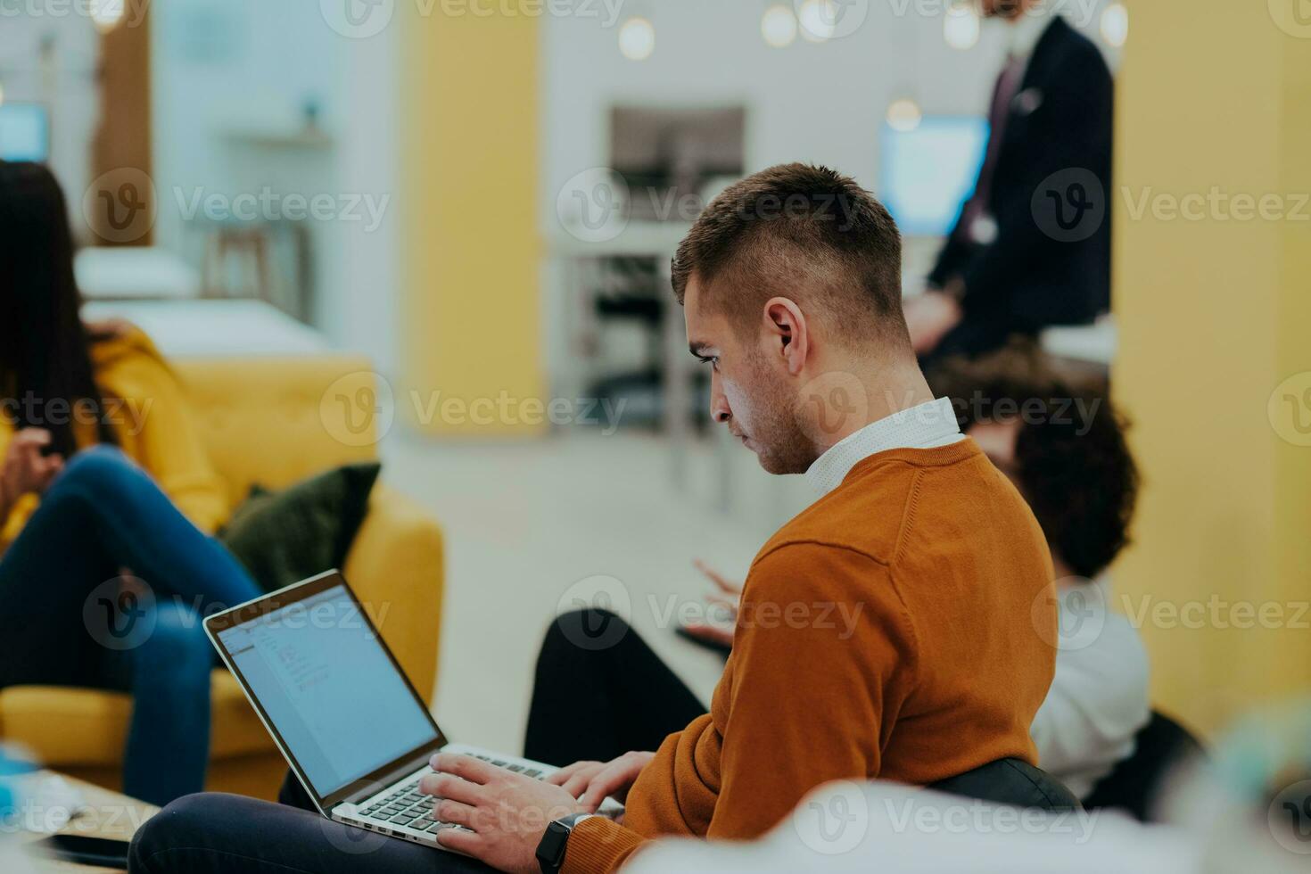 Multiethnic group of employees working in a marketing company. A group of colleagues is working on a project in modern offices photo