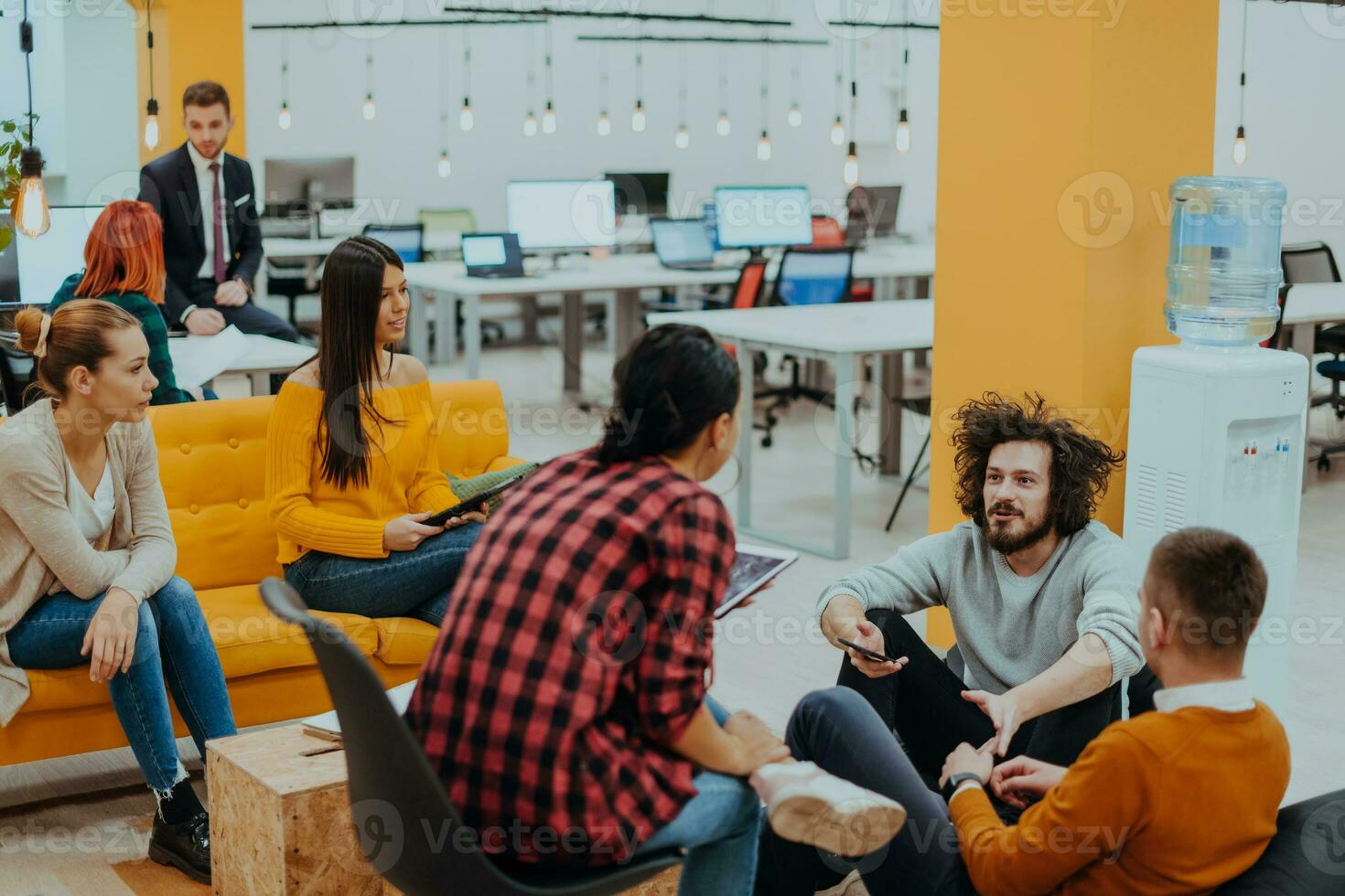 Multiethnic group of employees working in a marketing company. A group of colleagues is working on a project in modern offices photo