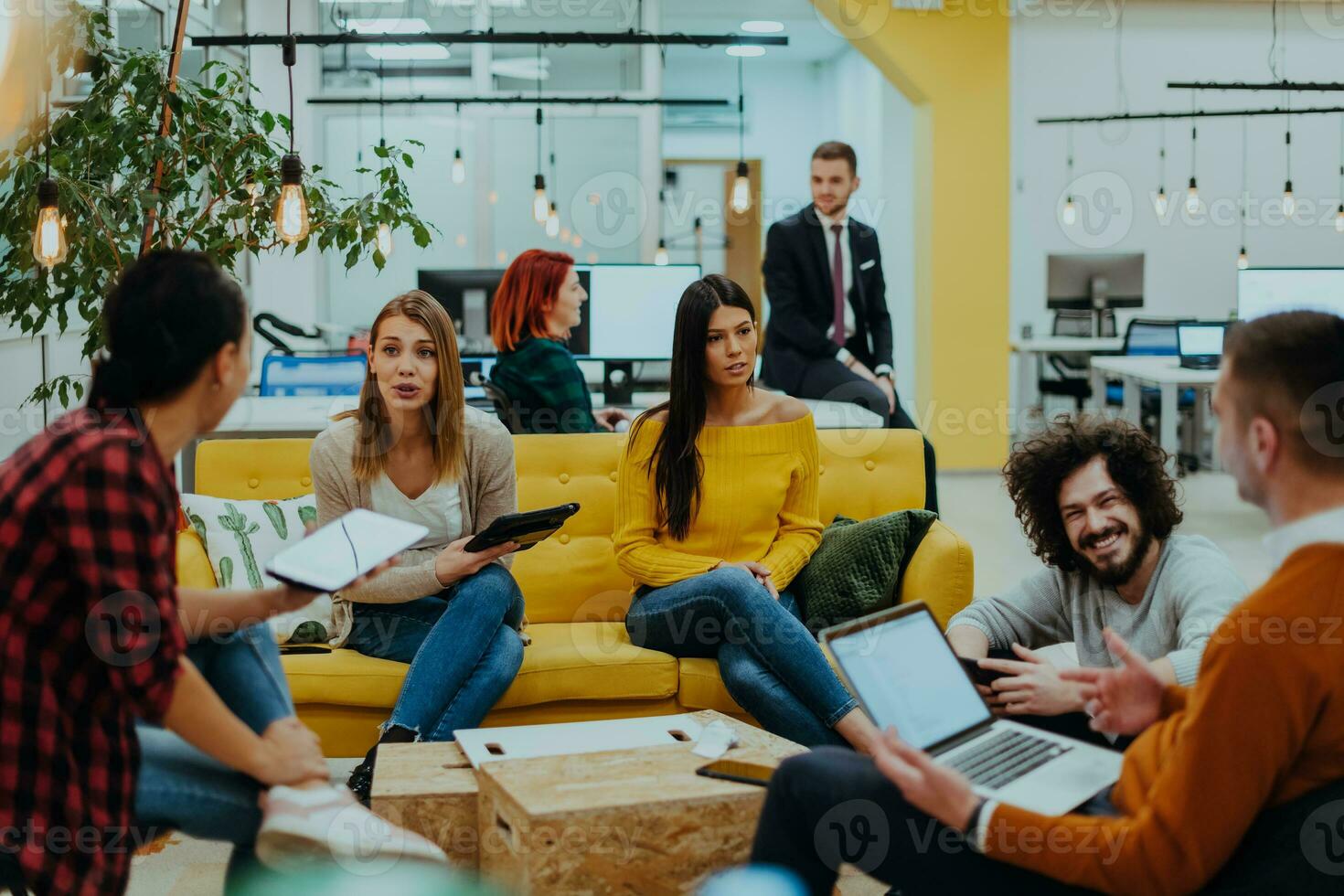 Multiethnic group of employees working in a marketing company. A group of colleagues is working on a project in modern offices photo