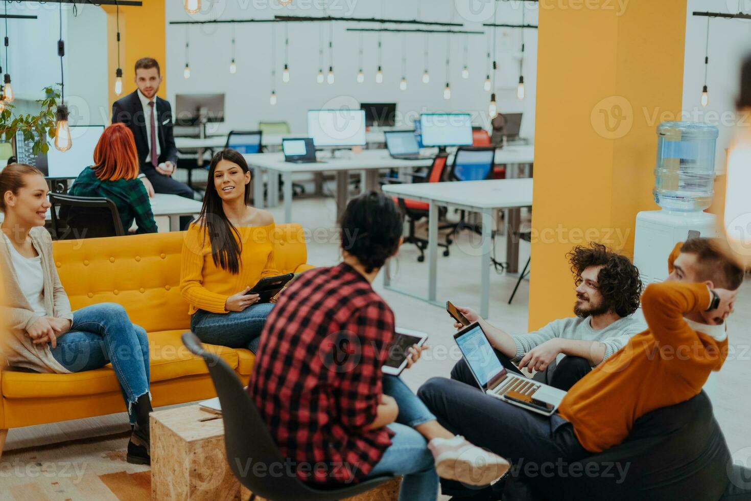 Multiethnic group of employees working in a marketing company. A group of colleagues is working on a project in modern offices photo