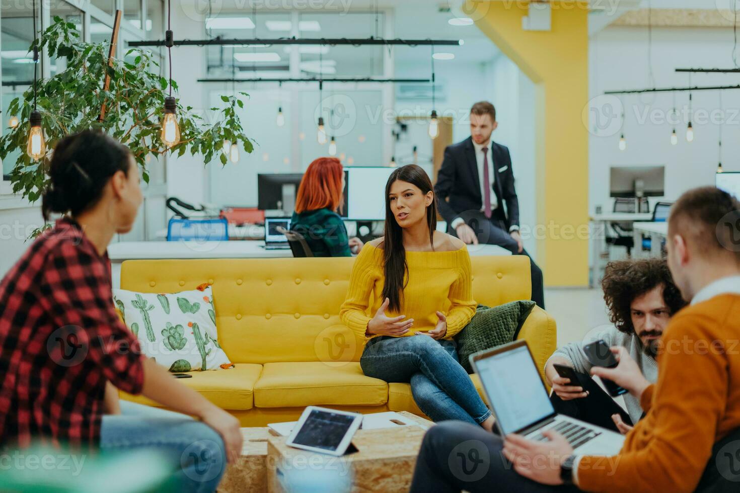 Multiethnic group of employees working in a marketing company. A group of colleagues is working on a project in modern offices photo