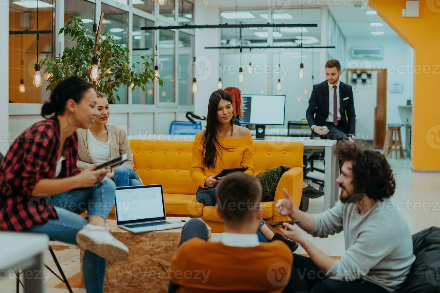 Multiethnic group of employees working in a marketing company. A group of colleagues is working on a project in modern offices photo