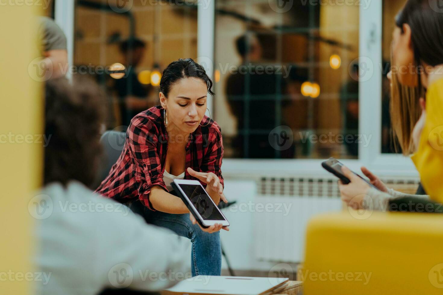 Multiethnic group of employees working in a marketing company. A group of colleagues is working on a project in modern offices photo