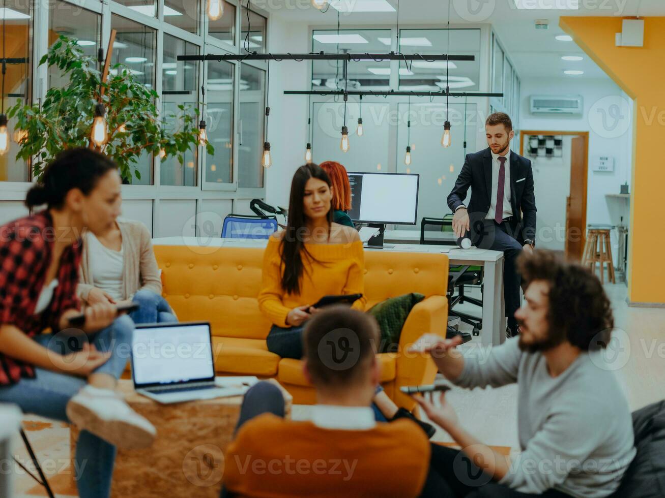 Multiethnic group of employees working in a marketing company. A group of colleagues is working on a project in modern offices photo