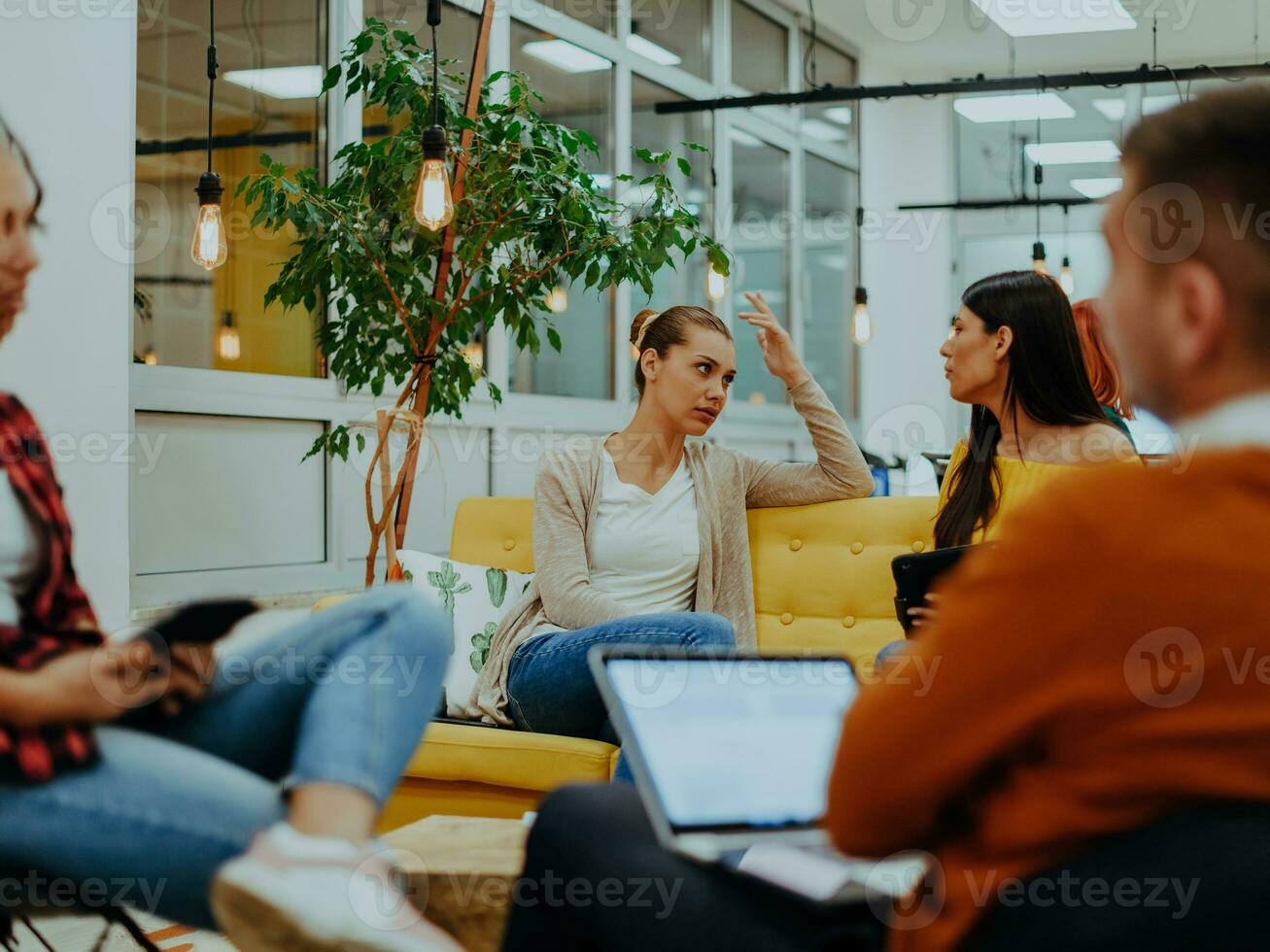 Multiethnic group of employees working in a marketing company. A group of colleagues is working on a project in modern offices photo