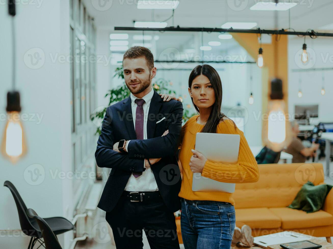 The boss of the company talking to his employee while she shows him the final report on the laptop photo