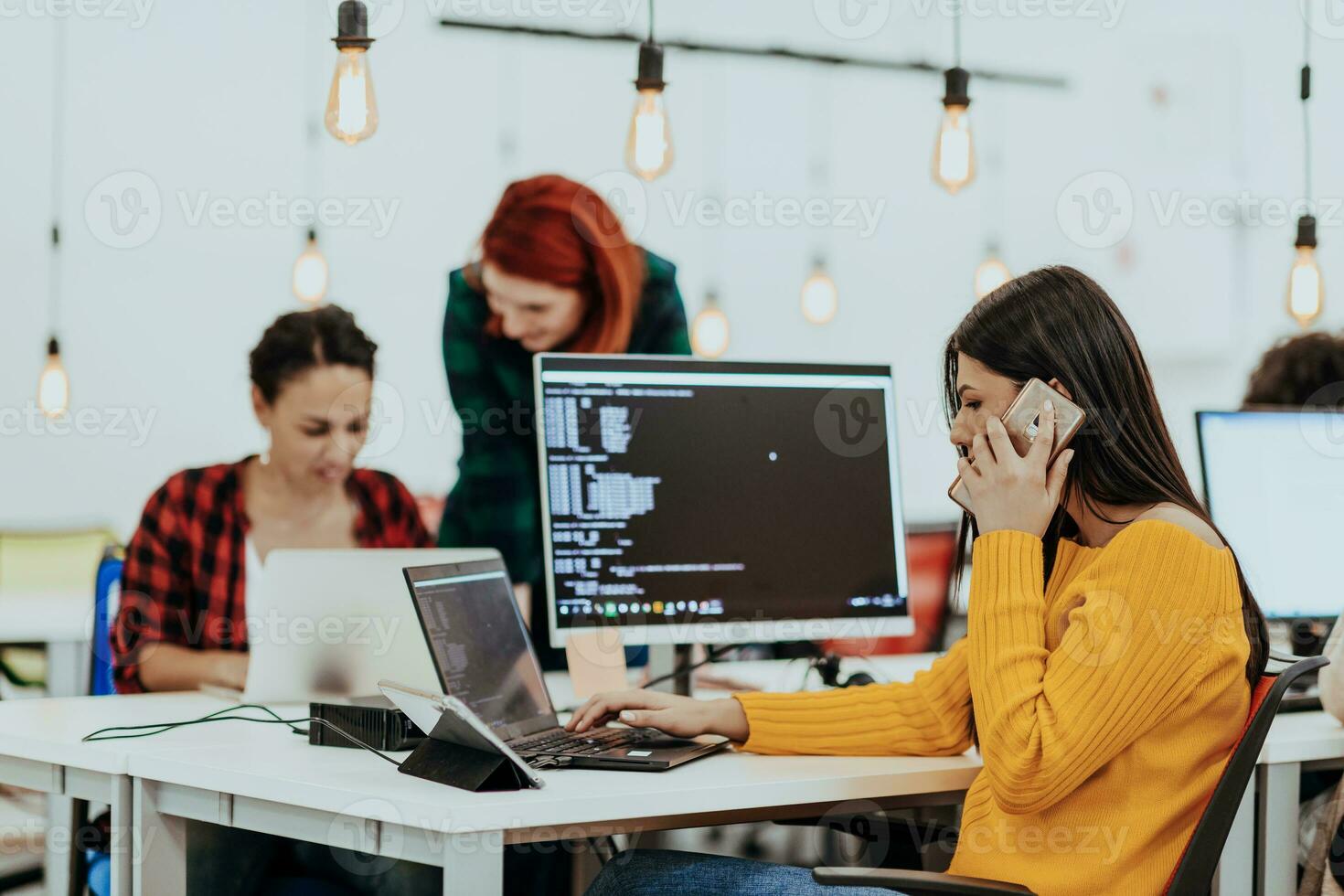Multiethnic group of employees working in a marketing company. A group of colleagues is working on a project in modern offices photo