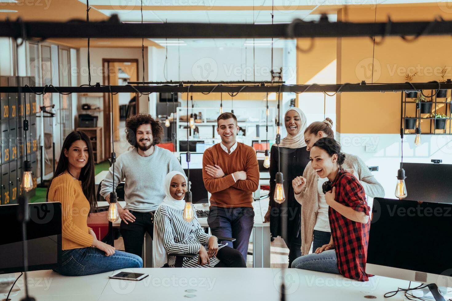 Multiethnic group of employees working in a marketing company. A group of colleagues is working on a project in modern offices photo
