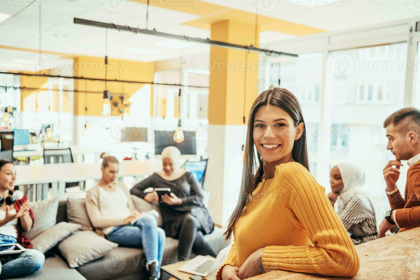 Multiethnic group of employees working in a marketing company. A group of colleagues is working on a project in modern offices photo
