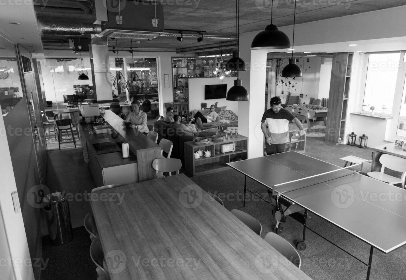 playing ping pong tennis at creative office space photo