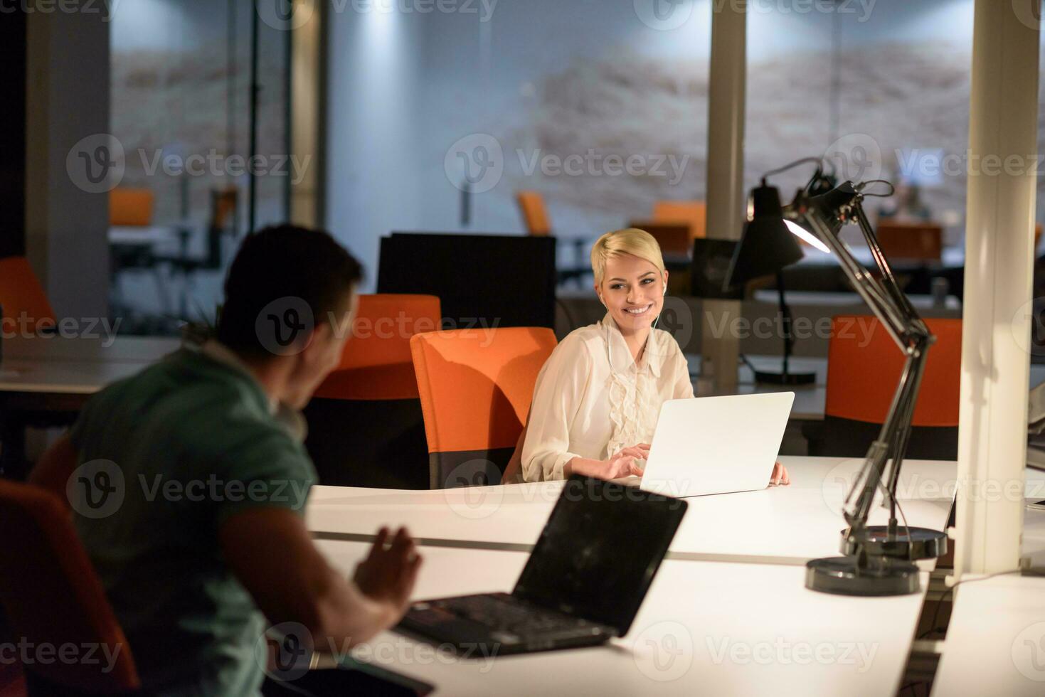 designers in the night startup office photo