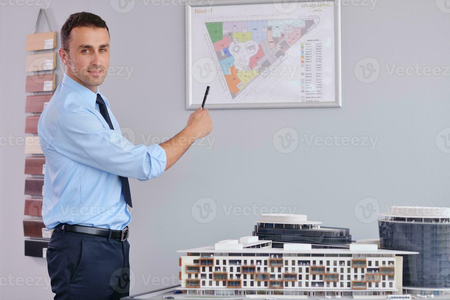 happy young business man at office photo