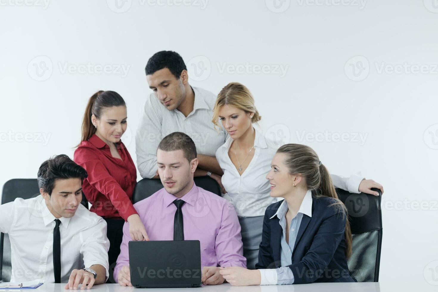 Group of young business people at meeting photo