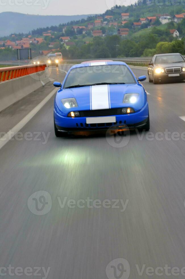 Tuning cars sacing down the highway photo