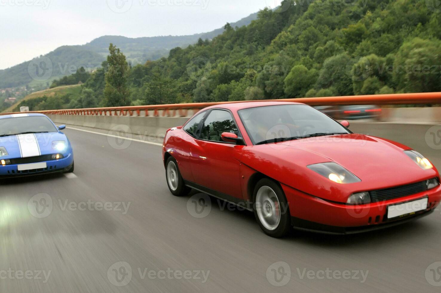 Tuning cars sacing down the highway photo