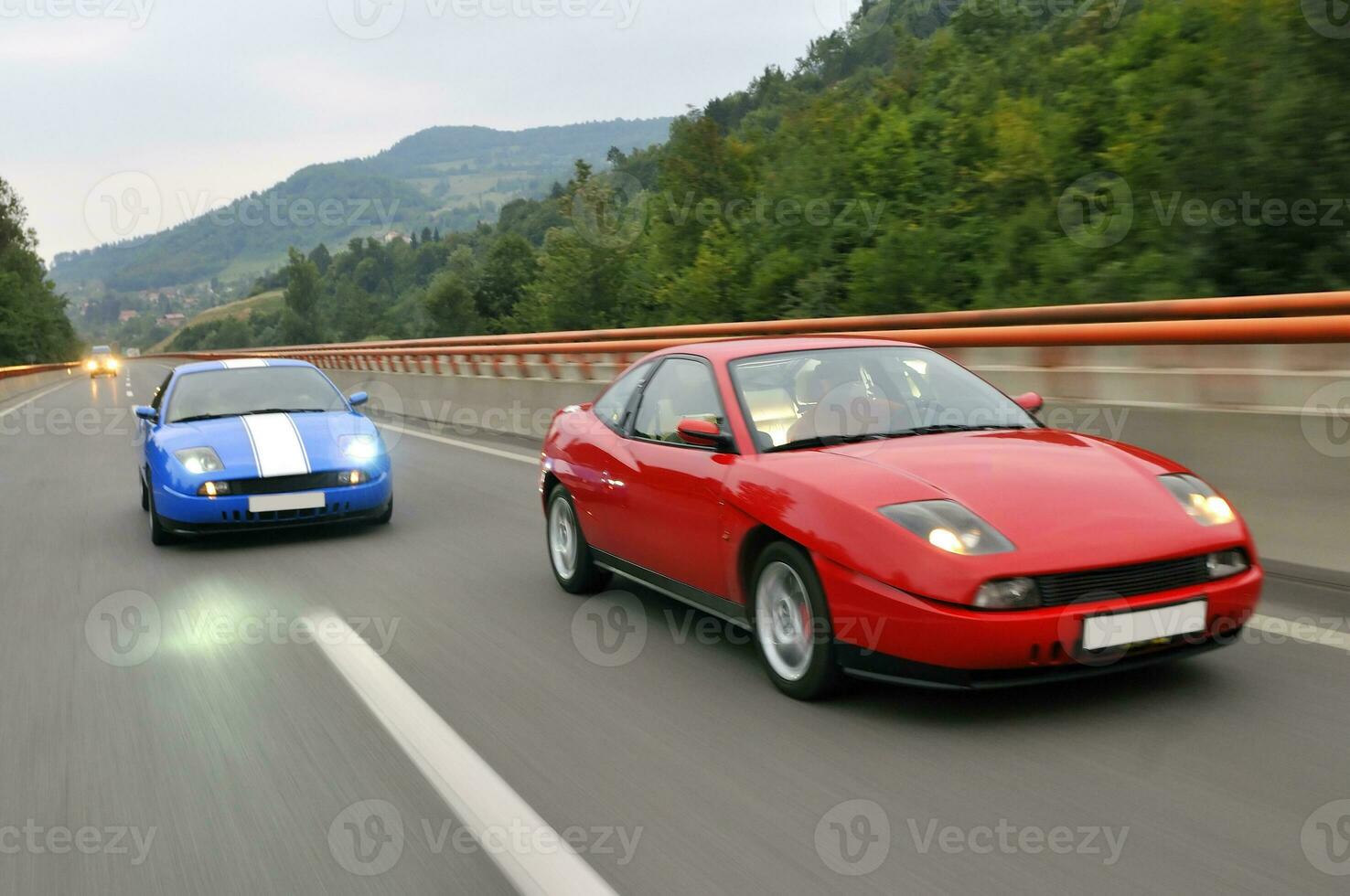 Tuning cars sacing down the highway photo