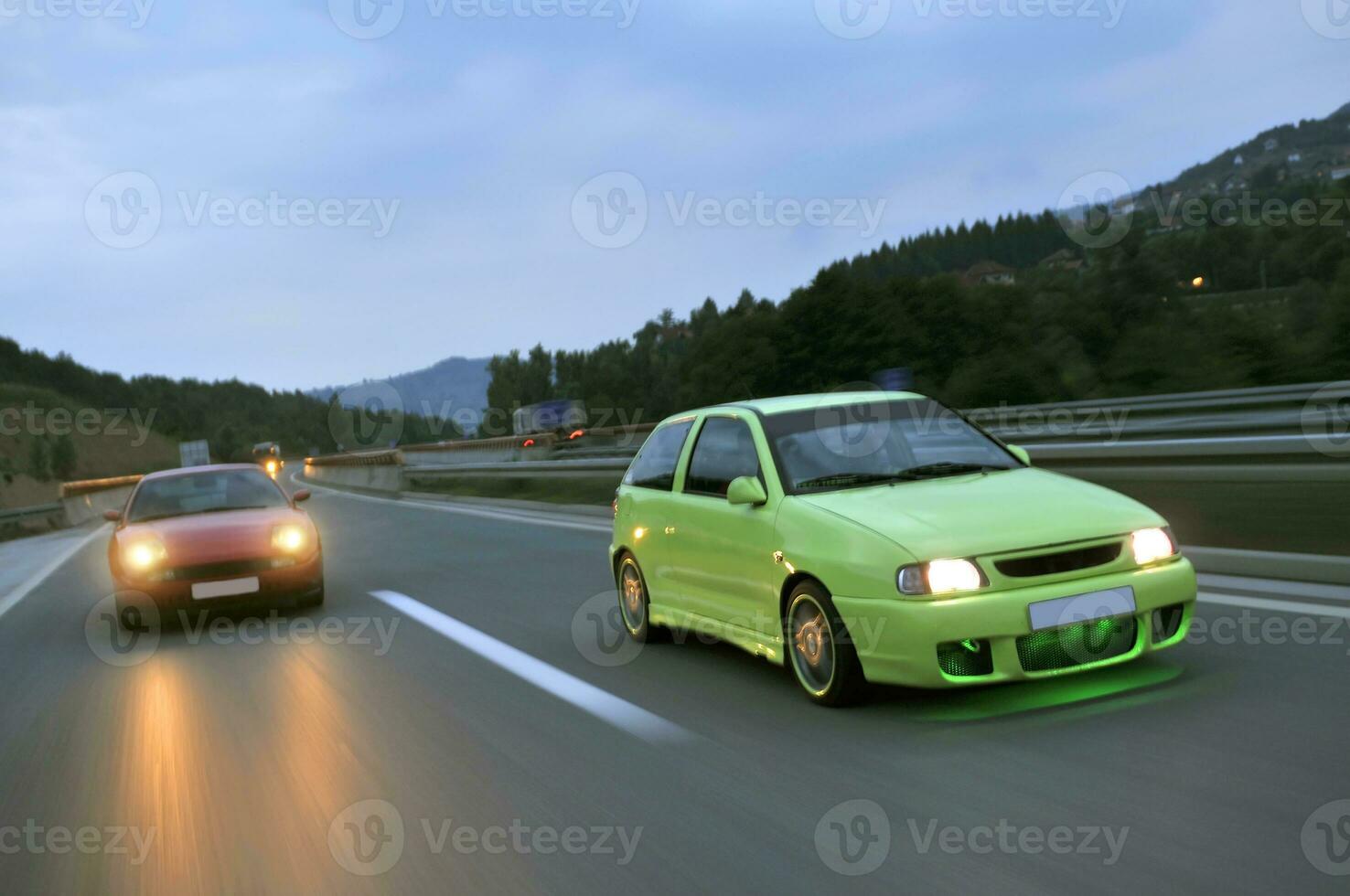 Tuning cars sacing down the highway photo