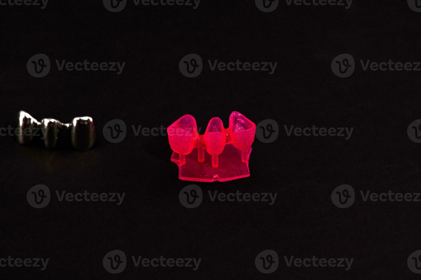 Teeth implant and crown installation process parts isolated on a black background. Medically accurate 3D model. photo