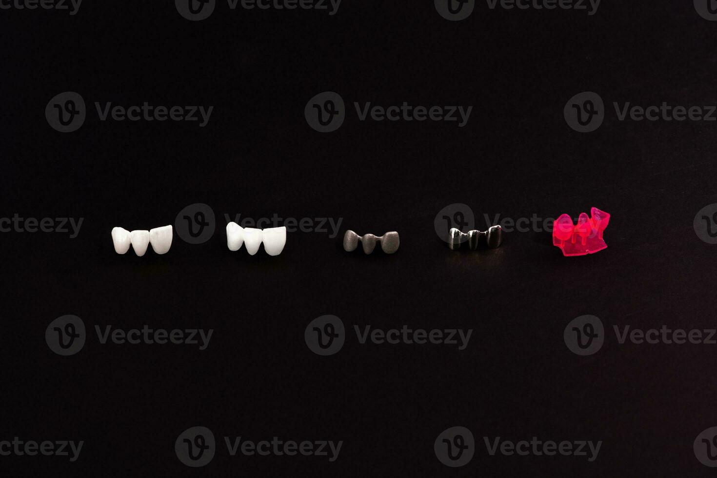 Teeth implant and crown installation process parts isolated on a black background. Medically accurate 3D model. photo