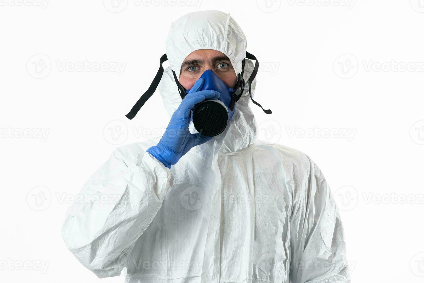 Doctor wearing protective biological suit and mask due to coronavirus 2019-nCoV global pandemic warning and danger background against white background. photo